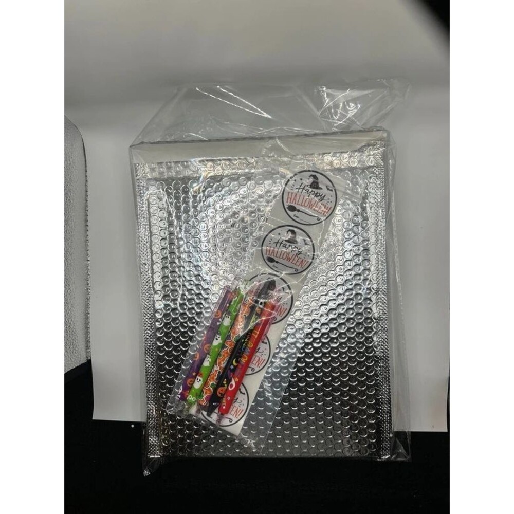 10 pack silver metallic bubble mailers with Halloween stickers and pens